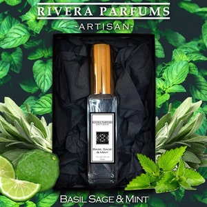 May include: A small glass bottle of Basil Sage & Mint perfume in a black box with a gold lid. The bottle has a gold cap and a label that says "Basil Sage & Mint".