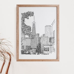 May include: A black and white line drawing of the San Francisco skyline, featuring the Transamerica Pyramid, in a wooden frame.
