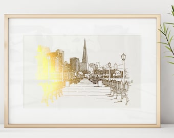 Könnte beinhalten: Eine gerahmte Schwarzweiß-Skizze einer Skyline mit einem hohen Gebäude in der Mitte. Die Skizze ist auf weißem Hintergrund und hat einen Goldfolieneffekt. Der Rahmen ist golden.