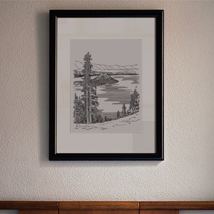 May include: A black framed print of a line drawing of a lake with an island in the middle, surrounded by trees. The print is hanging on a wall above a bed with a white headboard.