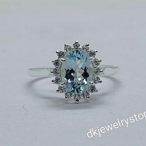 Oval Aquamarine Halo Ring: Sterling Silver March Birthstone