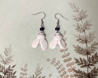 Small white moth earrings with hypoallergenic ear hooks. Dangle insect earrings with hand sculpted butterfly.