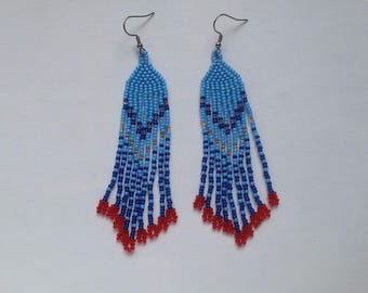 Long blue beaded earrings with red at the ends of fringes. Long boho earrings for walking around.