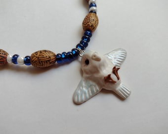 Small snowy owl necklace with wood burning and glass beads. Flying owl necklace for nature and forest lovers gift. Cute white owl charm.