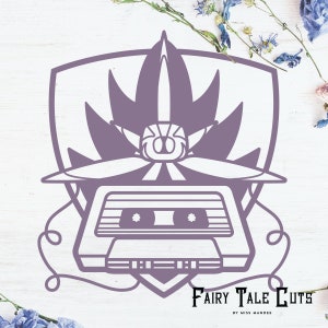 May include: A purple and white cassette tape with a flower design and the text "Fairy Tale Cuts by Miss Mandee".