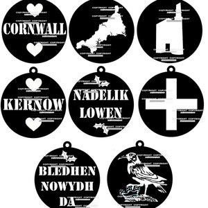 May include: Six black and white Christmas ornaments with various designs. The ornaments feature a heart, a map of Cornwall, a church, a cross, a raven, and the text "Bledhen Nowydh Da" and "Kernow" and "Nadelik Lowen".