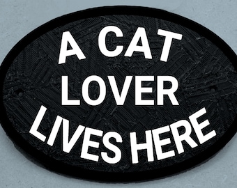 Archivo STL para impresión 3D "Aquí vive un amante de los gatos"