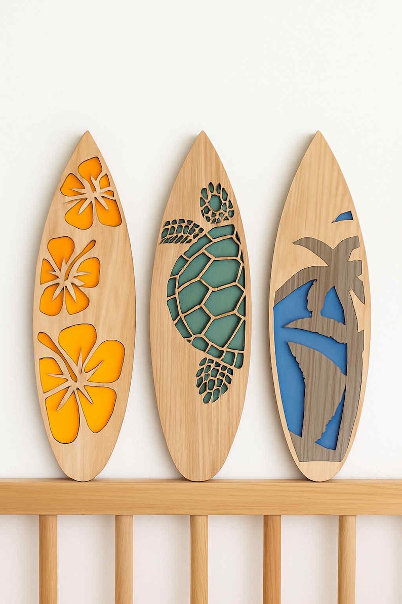 May include: Three wooden surfboards with decorative cutouts. One features orange hibiscus flowers, another a teal turtle, and the last a palm tree with blue accents. The surfboards are displayed on a wooden shelf.