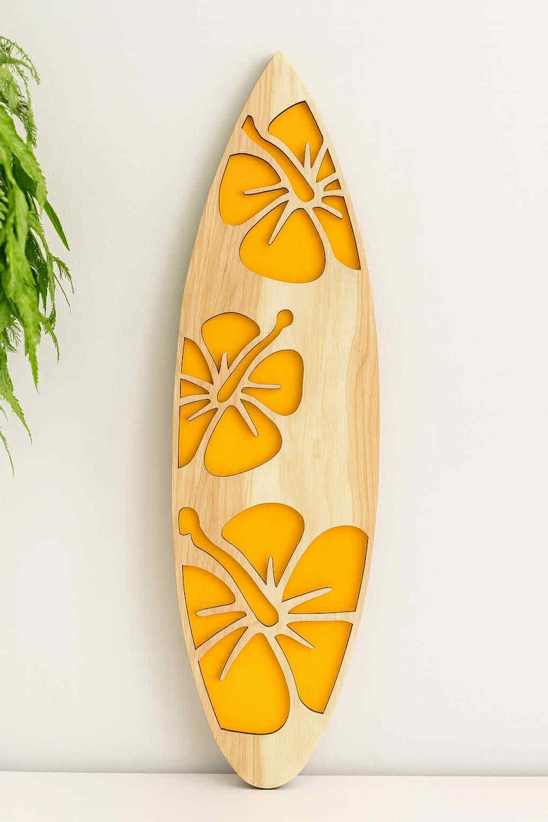May include: Wooden surfboard-shaped wall art with three yellow hibiscus flower cutouts. The surfboard is made of light-colored wood and is mounted on a white wall. The yellow flowers add a pop of color.