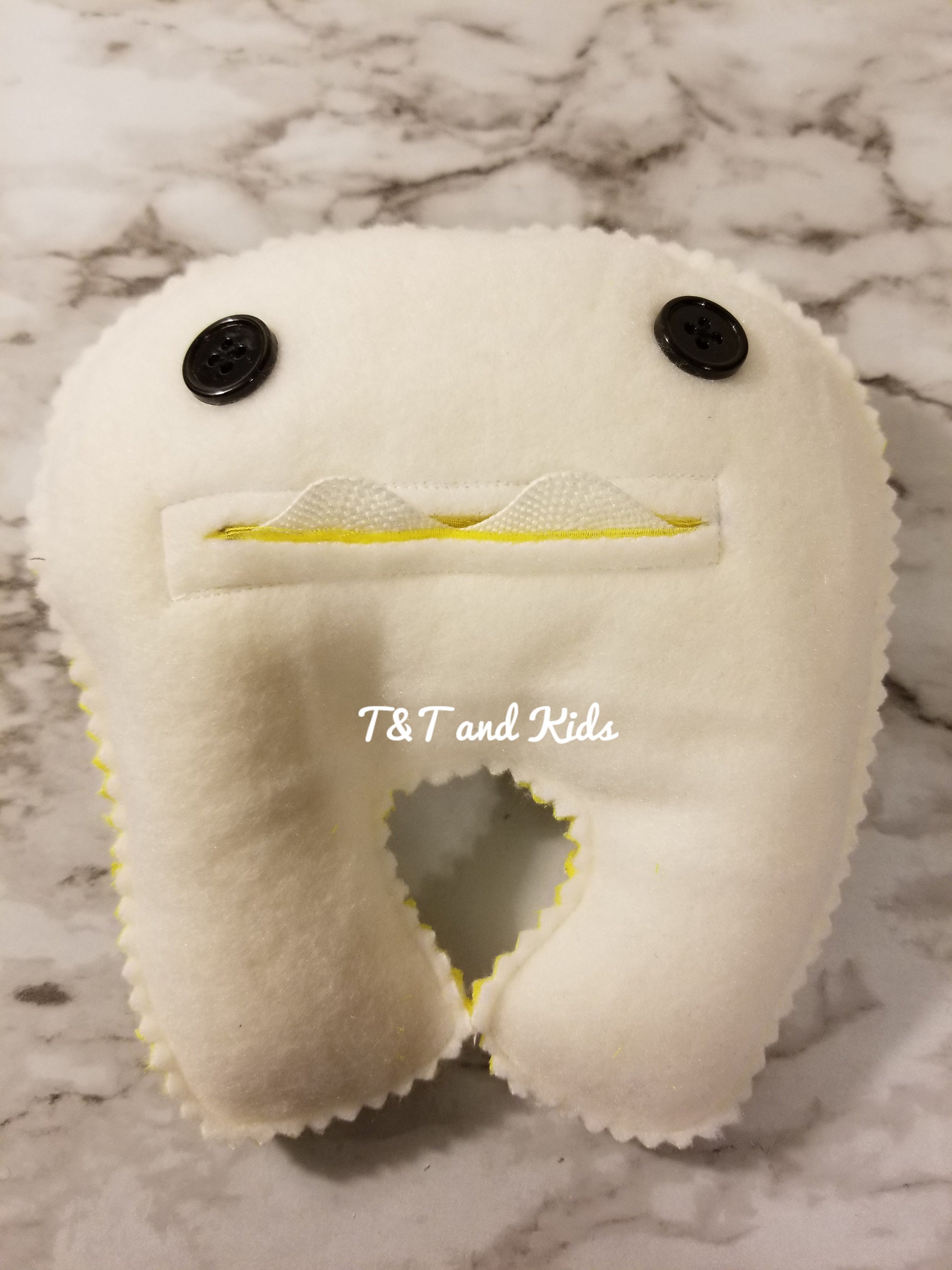 stuffed animal with baby teeth