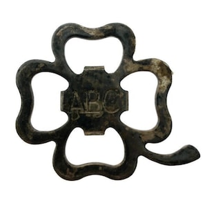 Crown subtractor / caplifter in image of a four-leaf clover ABC BLANCO NEGRO