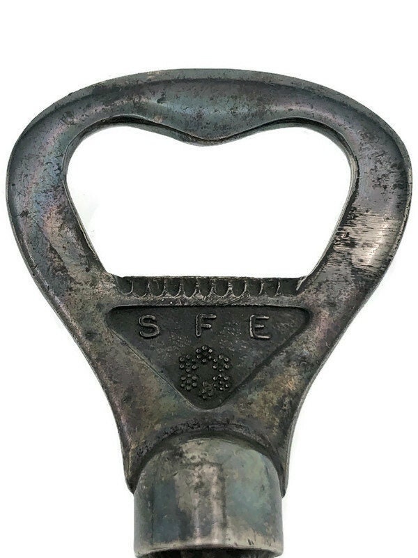 Silver (?) Crown subtractor with SFE emblem
