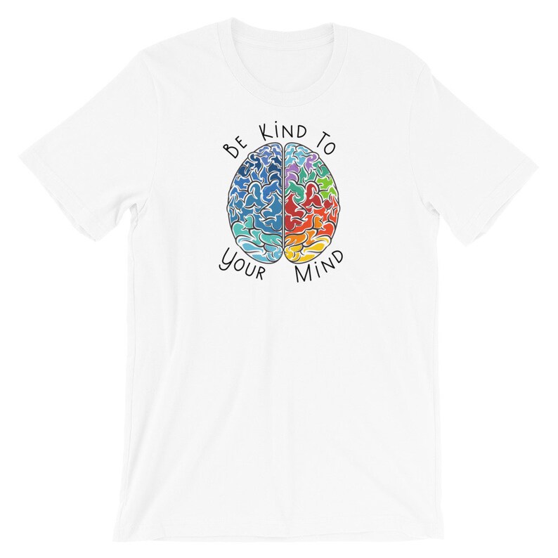 May include: White t-shirt with a colorful brain graphic and the text "Be Kind To Your Mind".