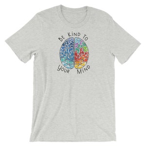 May include: Gray t-shirt with a colorful brain graphic and the text "Be Kind To Your Mind".