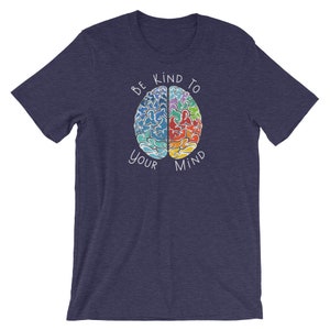 May include: A navy blue t-shirt with a colorful brain graphic and the text "Be Kind To Your Mind".