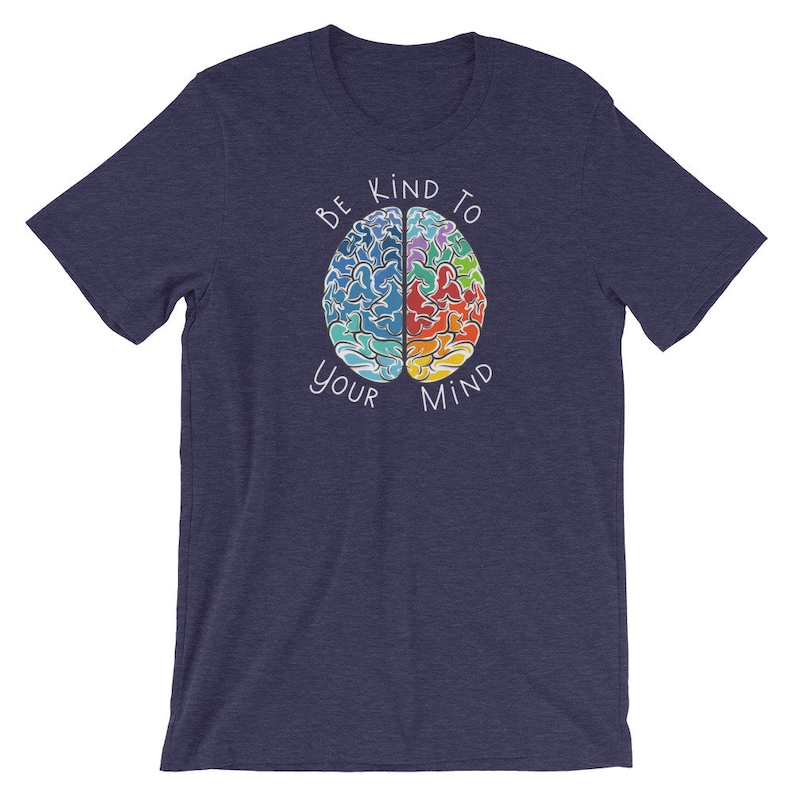May include: A navy blue t-shirt with a colorful brain graphic and the text "Be Kind To Your Mind".