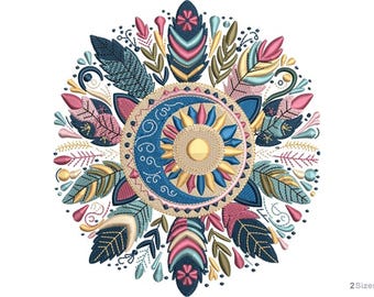 May include: Embroidered design featuring a central sun and crescent moon motif, surrounded by colorful feathers and floral elements. The design incorporates shades of blue, pink, yellow, and green, creating a detailed and decorative pattern. The design is suitable for various craft projects.