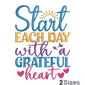 May include: Embroidered design with a colourful quote: "Start each day with a grateful heart". The quote is in a cursive font with a sun and two hearts. The design is available in two sizes.