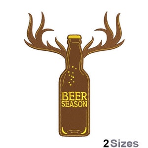 May include: Brown embroidered design of a beer bottle with antlers and the text "Beer Season".