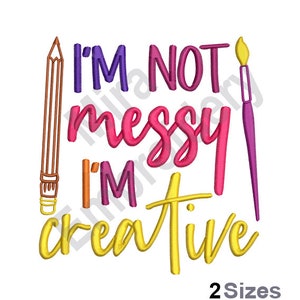May include: Embroidered design with a pencil and paintbrush, and the text "I'm not messy I'm creative". The text is in a variety of colors, including pink, yellow, and orange.