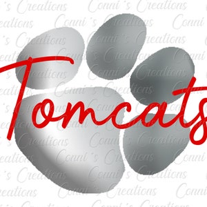 Può includere: Un'impronta di zampa argentata con la parola "Tomcats" scritta in lettere corsive rosse.