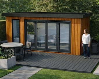 May include: A contemporary garden building with a wooden facade and black detailing. It has large glass doors, a deck, and a small pool. A woman stands nearby. A table and chairs are on the deck.