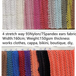 May include: A selection of patterned fabric swatches in various colours. The samples include white, pink, red, blue, and orange. The fabric is 160cm wide and suitable for clothing and DIY projects.