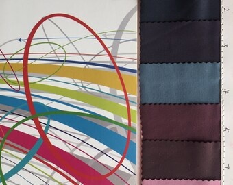 May include: Fabric swatches in a variety of colors, including navy blue, dark blue, teal, burgundy, pink, and white. The swatches are numbered 1 through 9.