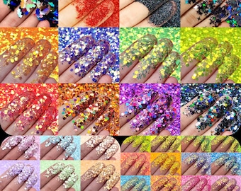 May include: A collection of colorful glitter samples displayed on fingertips. The glitter comes in various colors, including red, black, gold, blue, green, and purple. Some glitter has star and butterfly shapes. Ideal for nail art, crafts, or cosmetic applications.