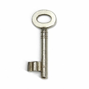 May include: A silver-toned skeleton key with a round head and a small, decorative side piece.