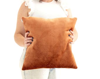 Funda de cojín de terciopelo texturizado color naranja sombra