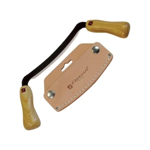 May include: A Flexcut draw knife with a curved black blade and wooden handles. Includes a tan leather sheath with the Flexcut U.S.A. logo. The knife is designed for woodworking and carving.