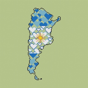 May include: A cross-stitch pattern depicting the map of Argentina on a light green background. The map is filled with a mosaic of blue and white hearts, with a central yellow and orange sun emblem positioned in the middle of the heart design.