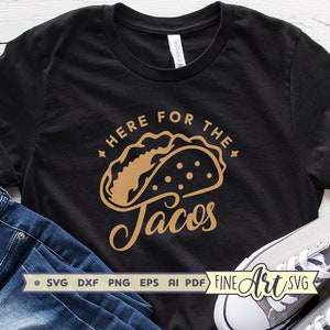 K&ouml;nnte beinhalten: Schwarzes T-Shirt mit einer goldenen Grafik eines Tacos und dem Text "Here for the Tacos".