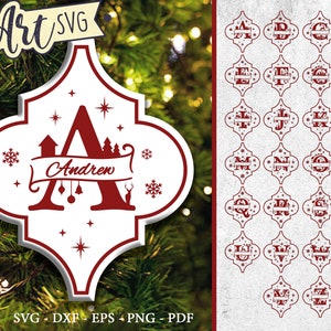 May include: A set of 26 printable Christmas ornament SVG files featuring a red and white Moroccan tile design with a letter in the centre and a banner for a name. The ornament design includes snowflakes and stars. The example ornament features the letter A and the name Andrew.