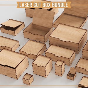 May include: A collection of laser-cut wooden boxes in various sizes, some with open lids. The boxes are light brown with dark brown edges, and the text "LASER CUT BOX BUNDLE" is displayed at the top. The boxes are arranged on a white surface.
