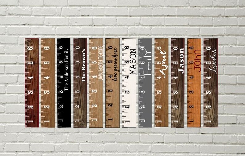 May include: A set of 12 wooden rulers with various names and phrases printed on them. The rulers are all 6 inches long and have a rustic wood finish.