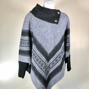 Asymmetrical women&#39;s top. Geometric patterns black and gray