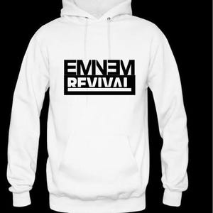May include: White hooded sweatshirt with black text that reads "EMINEM REVIVAL".