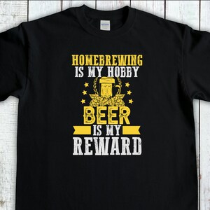 May include: Black t-shirt with a yellow graphic that says "Homebrewing is my hobby, Beer is my reward". The graphic includes a beer mug and hops.