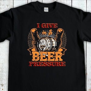May include: Black t-shirt with a graphic design of a beer barrel and the text "I give in to beer pressure".