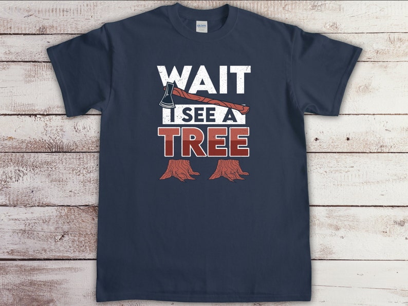 May include: Navy blue t-shirt with a white graphic of an axe and the text "WAIT I SEE A TREE".
