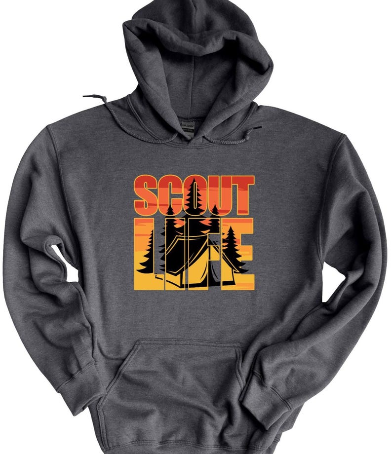 May include: Dark gray hooded sweatshirt with a front graphic. The graphic features the words "SCOUT LIFE" in orange and yellow, with a camping scene of a tent and trees.