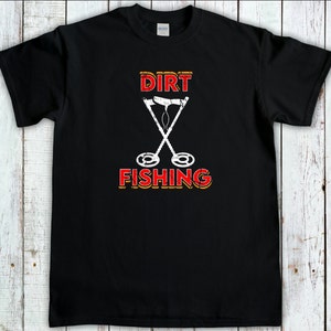 May include: Black t-shirt with a white graphic of two crossed metal detectors and the text "DIRT FISHING" in red and yellow.
