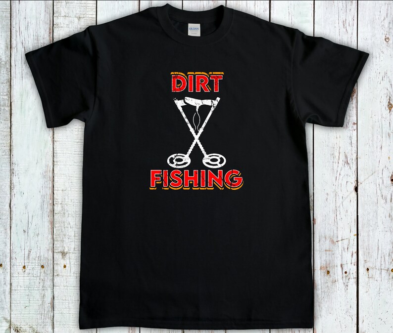 May include: Black t-shirt with a white graphic of two crossed metal detectors and the text "DIRT FISHING" in red and yellow.