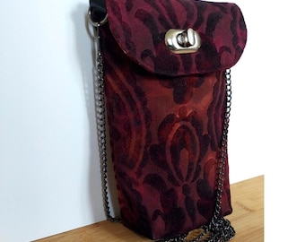 Quilted phone pouch worn over the shoulder