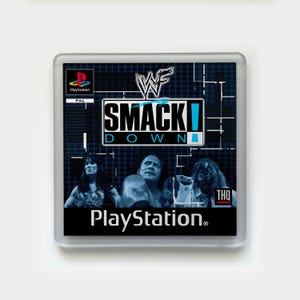 May include: A PlayStation game case for WWF SmackDown! featuring the WWF logo and images of wrestlers. The case has a blue and black background with the PlayStation logo and the text "SMACKDOWN" in large letters.