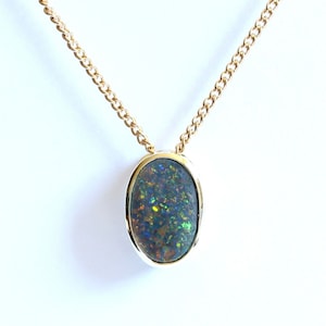 Natural semi black opal 1.12ct pendant set in 14ct yellow gold Made in Australia