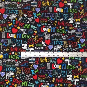 May include: Black fabric with a repeating pattern of colorful text that says "I love my dog" and other dog-related phrases. The fabric also features paw prints, hearts, and dog silhouettes.
