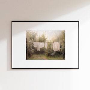 May include: A painting of a clothesline with white sheets hanging in a lush green forest setting. The sun shines through the trees, casting a warm glow on the scene.